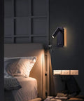 Bedroom setup with Two In One LED Wall Lamp And Reading Light Sconces for bedside use, lit with warm white 3000K lighting, black finish.