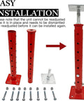 Front view of four red telescoping basement floor jacks with perforated posts, square base plates, and mounting hardware (bolts and nuts).