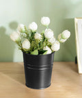 Black metal planter with white roses, part of 5 Pack 4 Inch Hanging Flower Pots Metal Dope Planters For Railing Fence Balcony And Garden Outdoor Decor With Detachable Hooks Ideal For Herb And Flower Gardens In Black