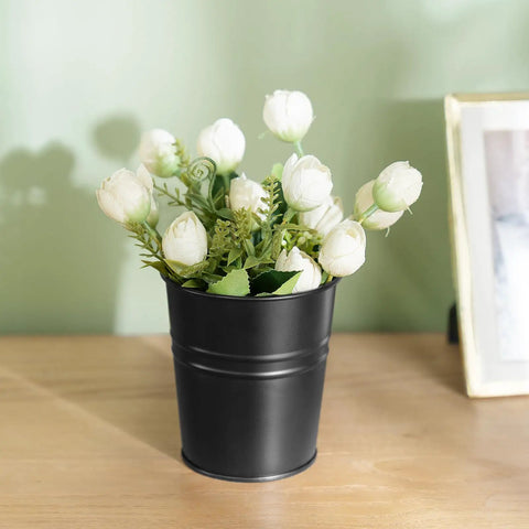 Black metal planter with white roses, part of 5 Pack 4 Inch Hanging Flower Pots Metal Dope Planters For Railing Fence Balcony And Garden Outdoor Decor With Detachable Hooks Ideal For Herb And Flower Gardens In Black