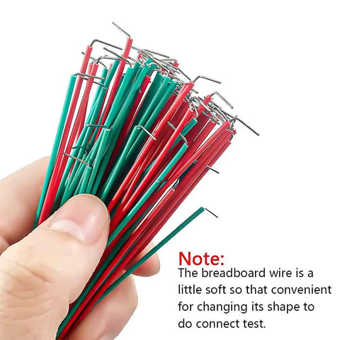 Close-up of hand holding 560 Piece Breadboard Jumper Wires Set For Arduino And Electronics, 24 AWG U Shaped Male To Male Cables