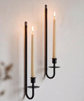 Built Tough Matte Black Farmhouse Wall Candle Sconce Holder Set of Two Heavy Duty Thick Iron Metal Wall Decor with Scratch Proof Finish for Warm Ambient Vibes, mounted with candles lit.