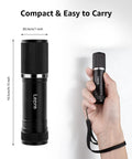 Compact LED Mini Flashlight With Tiny But Mighty Brightness held in hand showing size and lanyard
