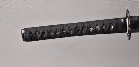 Practice Katana Sword with full tang aluminum steel blade blunt edge, close-up of handle with ray skin and cotton ito wrap