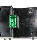 Top Shelf Aftermarket Headlight Dimmer And Dome Light Switch Delivering Snappy Instrument Panel Brightness Control For Hassle Free Dashboard Operation On Your Ride, black plastic back view with green connector.