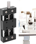 Built Tough Aluminum X Axis Sliding Table With Precision Manual Knobs For Micro Adjustments next to optical equipment.