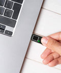 Hand inserting FIDO2 Fingerprint USB A Security Key for Passwordless Login into laptop for two factor authentication