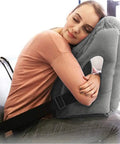 Woman resting on Inflatable Travel Pillow With 3D Eye Mask And Earplugs, Ultra Comfy Neck Support for Airplanes Trains Cars Office Naps