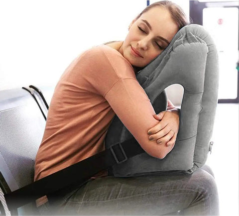 Woman resting on Inflatable Travel Pillow With 3D Eye Mask And Earplugs, Ultra Comfy Neck Support for Airplanes Trains Cars Office Naps