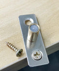 Close-up of stainless steel guide and screws from 4 Piece Roller Guide Set For Sliding Barn Doors In Stainless Steel Floor Guides For Track Hardware Durable Barn Door Accessories With Smooth Operation And Easy Installation Size 45mm Length 15mm Width 13mm Height.