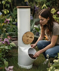 Person using a vertical worm compost bin space saver modular stackable system for small gardens and containers green 4 gallon capacity great for one to two people odor controlled and super easy to expand