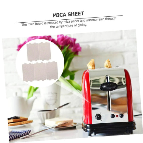 Two Sets Of Seven Microwave Mica Plates For Heat Insulation Replacement next to a red toaster in a kitchen.