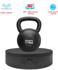 ComXim 4.53 Inch Black Rotating Display Stand Electric Turntable Spinning Platform With Adjustable Speed For Jewelry And Shoes Perfect Lazy Susan Photography Prop Easy To Switch Direction Compact Design showing 11lb kettlebell on turntable.