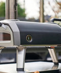 Side view of Gas Burner Attachment For Karu 12 2 12G Pizza Ovens, 28mbar Propane Conversion Kit installed on outdoor oven