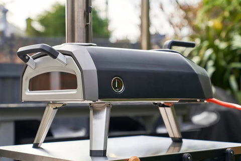 Side view of Gas Burner Attachment For Karu 12 2 12G Pizza Ovens, 28mbar Propane Conversion Kit installed on outdoor oven