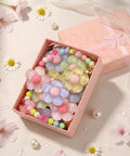 Pastel Jelly Daisy Flower Shoe Charms Set With Glossy Bling Floral Buckles in a pink gift box, featuring colorful flower clips.