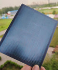 Ultra Thin Flexible CIGS Solar Panel Charger For Portable Power On The Go, held outdoors showing flexibility and design.