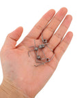 Hand holding Heavy Duty 10 Pack Torsion Spring Kit For Trash Can Lid Repair With Smooth Action And Quick DIY Replacement Featuring Corrosion Resistant Stainless Steel Build And Tight Coil Design That Makes Recycling Bins Open Like New Again Without Hassle Or Extra.