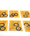 Black 1/2x28 Barrel Shim Kit For 223 5.56 Caliber, 14 Pack, Stainless Steel Shims With Six Thickness Options displayed on packages