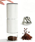 Lightweight Portable Electric Coffee Grinder With Rechargeable Battery And Usb C Fast Charge For No Sweat Travel Days Featuring 30 Adjustable Conical Burr Settings To Nail That Sweet Morning Grind In Clean White Finish with ground coffee and beans.