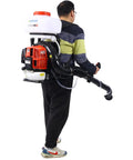Person wearing gas powered backpack sprayer and cold fogger with 51.7cc engine and 14L tank for garden spraying.