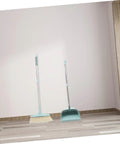 Top Shelf Long Handle Dustpan And Broom Set For All Hard Floors, No Sweat Sweeping Kit For Wood Tile And Laminate displayed against a wall.