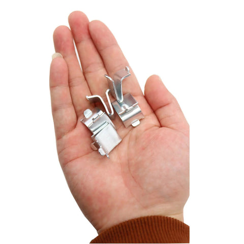 Close-up of hand holding 14 Piece Silver Adjustable Steel Shelf Clip Supports For Metal And Wood Shelves, pilaster bracket clips.