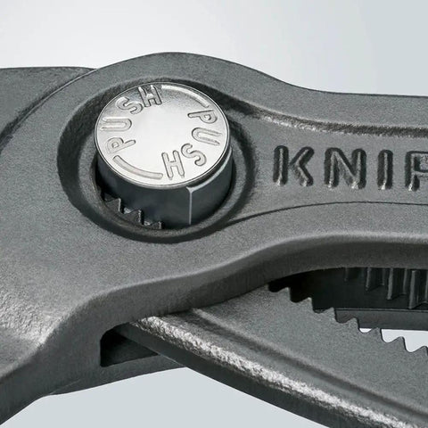 Close-up of push button adjustment on Cobra Water Pump Pliers With Seven And A Quarter Inch Length, V Jaw Style.