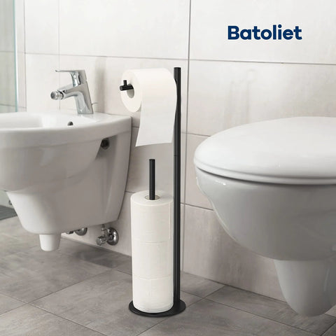 Free Standing Black Toilet Paper Holder Stand With Reserve Storage beside toilet in bathroom setting.