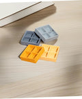 Four Piece Miniature Dollhouse Platter Set With Realistic Four Grid Resin Box For Candy And Nuts on wooden surface