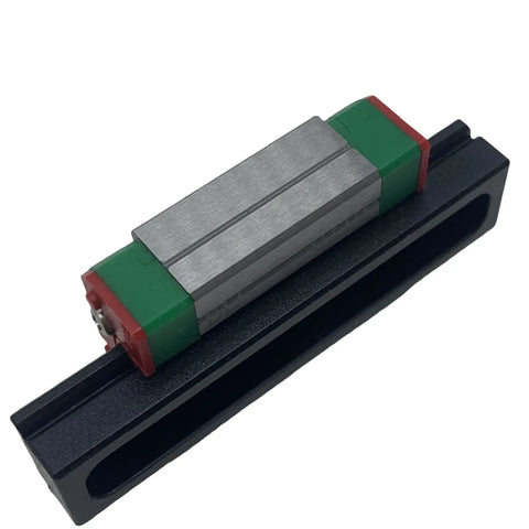 MGN12C Linear Guide Rail With Carriage And Slider For CNC Machines And 3D Printers Stainless Steel Anti Corrosion Block And Rail Gothic Arch Contact Design Delivers High Rigidity And Smooth Motion For Automation And Semiconductor Projects, showing a stainless steel block on a black rail.