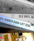 Comparison of old vinyl seal and new 100% rubber Dura-Lift seal for garage doors, showcasing material upgrade.