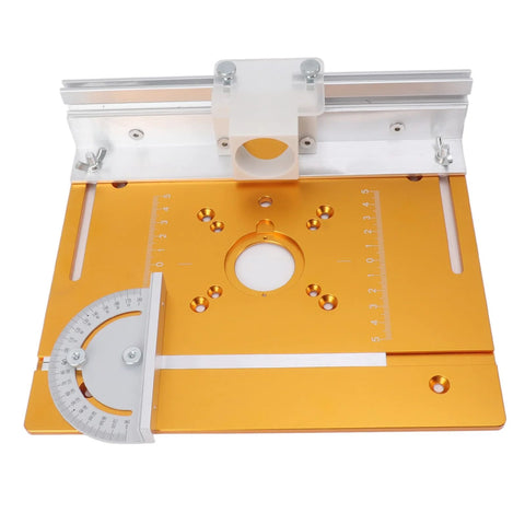 Front view of orange aluminum router table insert plate with opening, side measurement rulers, and white mounting block