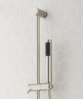 Signature Hardware Gunther 1.8 GPM Pressure Balanced Shower System with hand shower and metal arm on tiled wall.
