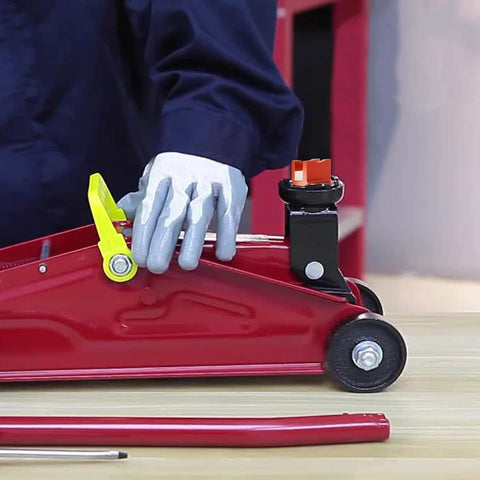 DEDC universal aluminum grooved magnetic jack pad on a red floor jack beside a car wheel