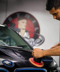 Man using Quantum Best Of The Best Buffing And Polishing Pad Kit on car with DA polisher for a pro-grade shine