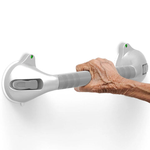16.5 Inch Suction Bath Grab Bar With Indicators For Balance Help Shower Handle On Flat Non Porous Tiles Silver Grey Secure Grip Easy Install Ideal For Seniors And Rehab Safety In The Shower in use by a hand.
