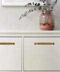 Antique Brass Cabinet Pulls 5 Inch 128mm Hole Centers Zinc Alloy Vintage Drawer Handles for Kitchen Cabinets 10 Pack installed on white cabinet