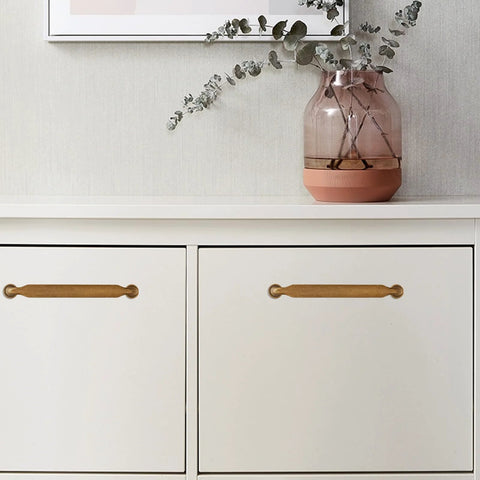 Antique Brass Cabinet Pulls 5 Inch 128mm Hole Centers Zinc Alloy Vintage Drawer Handles for Kitchen Cabinets 10 Pack installed on white cabinet