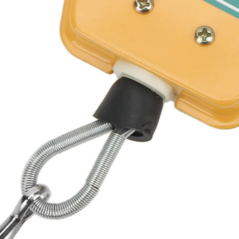 Close-up of Heavy Duty Retractable Spring Balancer with safety lock, featuring spring and hook for workshop tool use.