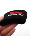 Ride Ready Front Brake Fluid Reservoir Protection Cover And Oil Filler Cap Sock for GSXR 600 750 1000 Motorcycles held in hand.