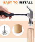 Hand using a hammer to install No Sweat 24 Pack Transparent Furniture Sliders With NailOn Pins on wood furniture leg.