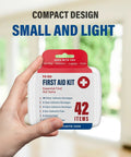 Person holding compact first aid kit from Massive 4000 Piece First Aid Kit With 96 Pack Boxes And 42 Items Each For Home Travel Car Work