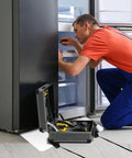 Man repairing fridge with toolbox open, appliance on Heavy Duty Appliance Moving Sliders for Furniture, 660 Pound Capacity, Non Scratch Floor Pads.