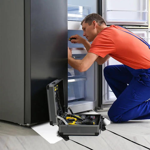 Man repairing fridge with toolbox open, appliance on Heavy Duty Appliance Moving Sliders for Furniture, 660 Pound Capacity, Non Scratch Floor Pads.