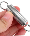 Eight Pieces Extended Compression Spring Assortment Kit For Electric Vehicle Stands Ladder Foot Supports With Heavy Duty Stainless Steel Build For Reliable Structure And Smooth Easy Use In Garage Or Home Projects. stainless steel compression spring with loop ends held in hand