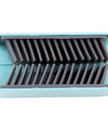 Hair Catcher, Reusable Silicone Drain Protector for Bathtub Shower Wall, top view showing flexible gray bristles in turquoise holder.
