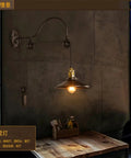 Hella Stylish Wrought Iron Wall Sconce With Adjustable Pulley Lift Vintage Industrial Loft Light Fixture For Cozy Home Cafe Bar Decor and Top Shelf Ambient Room Upgrades, mounted on grey wall above a wooden table.