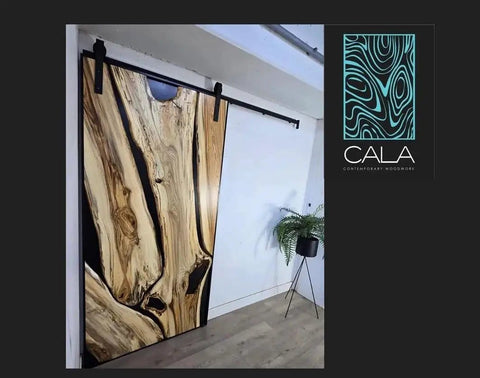 Handcrafted Live Edge Spalted Hackberry Barn Door With Custom Sizing Made To Order In Minnesota Totally One Of A Kind Rustic Modern Wood Door For Hallway Or Entryway shown installed on hallway wall.