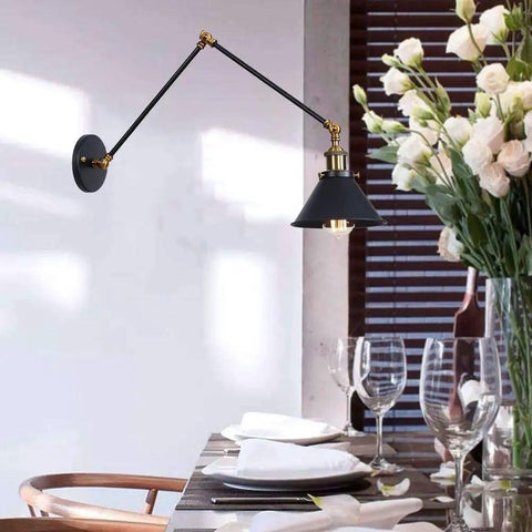 Heavy Duty Industrial Swing Arm Wall Sconce Built Tough For Living Spaces Vintage Metal Light Fixture in black finish with gold accents.